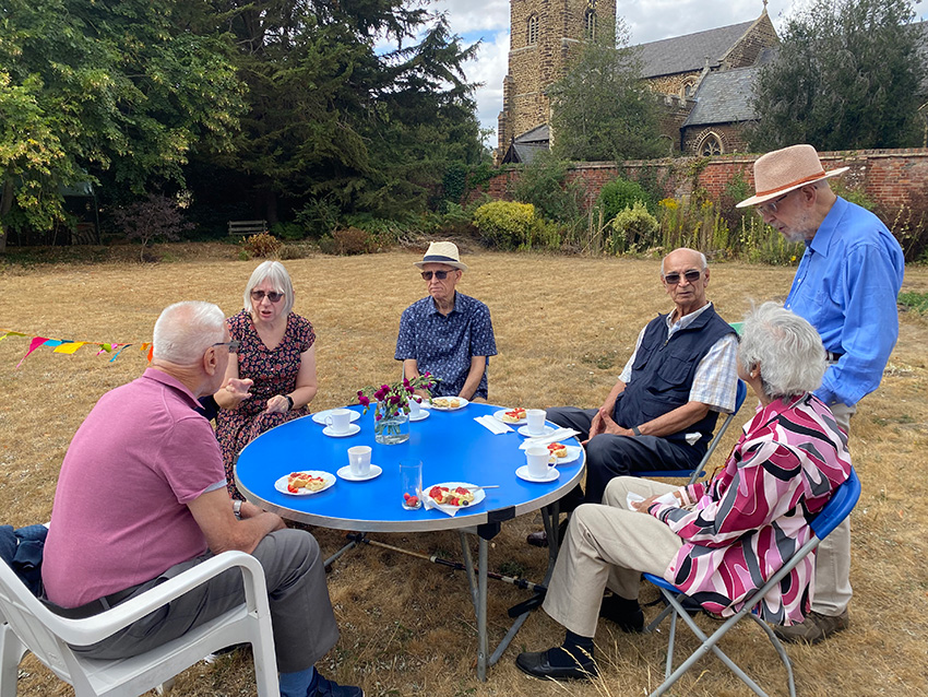 Folk enjoying a cream tea at the Rectory Gardens, St Swithun's, Sandy